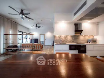 Spacious modern living room with open kitchen and stylish decor