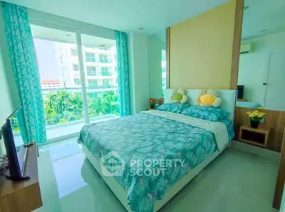 Bright and airy bedroom with large windows and modern decor in a high-rise apartment.