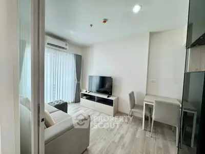 Modern living room with sleek furniture and natural light, perfect for relaxation and entertainment.