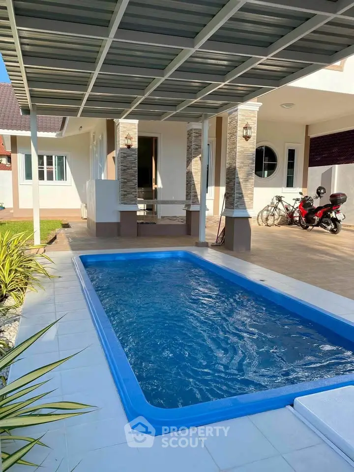 Charming home with private pool and covered patio, perfect for relaxation and outdoor activities.