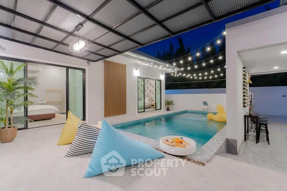 Luxurious modern villa with private pool and stylish outdoor seating area, perfect for relaxation and entertainment.