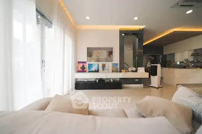 Spacious modern living room with elegant decor and open kitchen layout