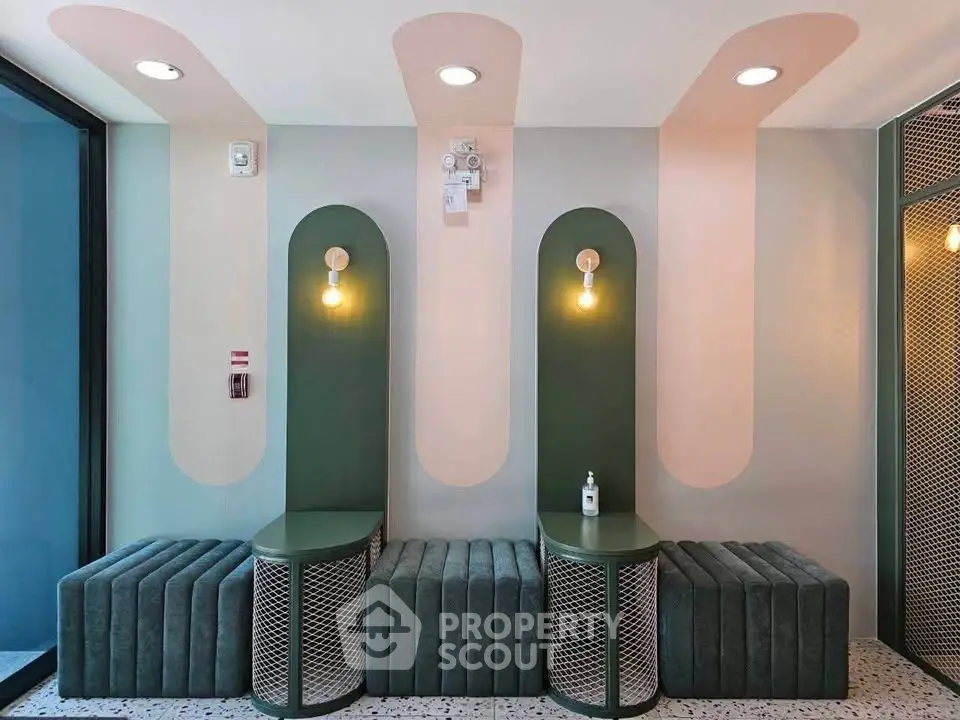 Stylish modern lobby with unique seating and lighting design, perfect for contemporary living spaces.