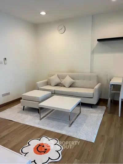 Modern living room with stylish white sofa and minimalist decor