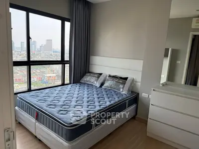 Modern bedroom with city view and stylish decor in high-rise apartment