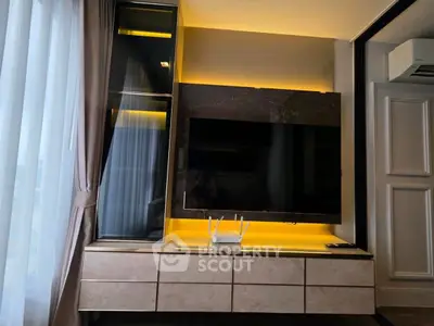 Modern living room with sleek TV setup and ambient lighting