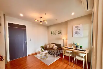 Cozy living room with modern decor and dining area in a stylish apartment.