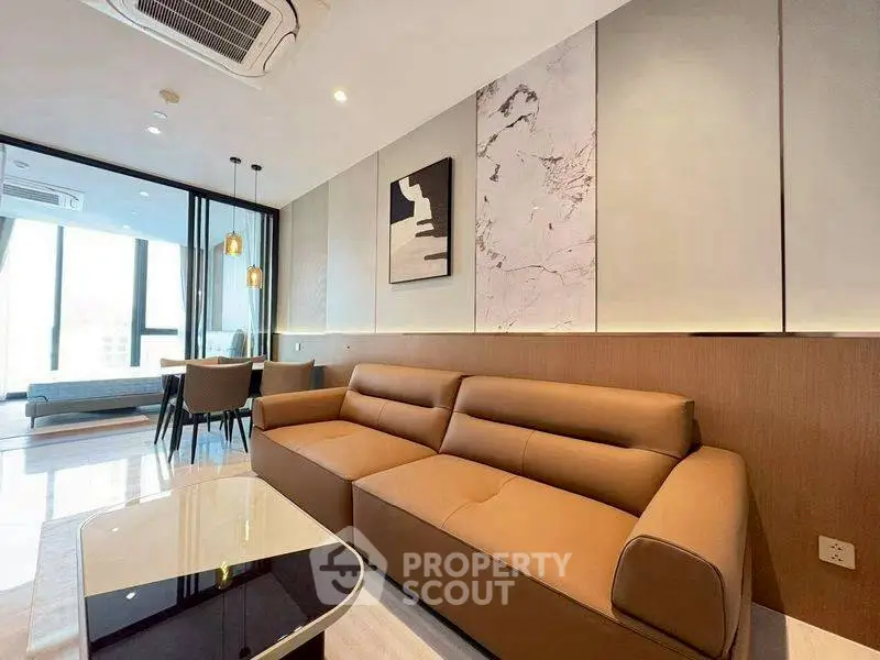 Luxurious modern living room with elegant decor and spacious seating area.