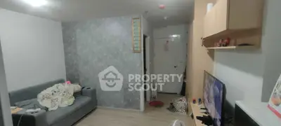 Cozy living room with modern decor and comfortable seating in a stylish apartment.