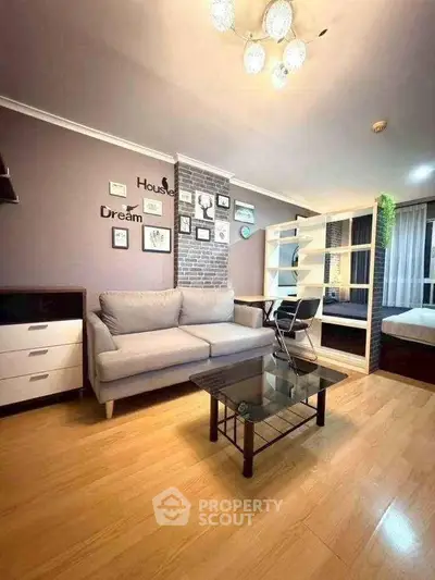 Modern living room with stylish decor and cozy ambiance, featuring a comfortable sofa and elegant lighting.