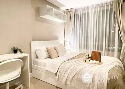 Elegant bedroom with plush bedding, modern furnishings, and tasteful decor, creating a serene and inviting atmosphere for restful slumber.