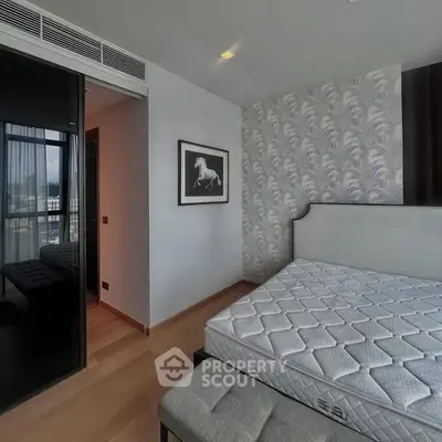 Modern bedroom with stylish decor and large window view