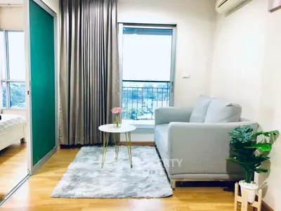 Cozy living room with modern decor and balcony view