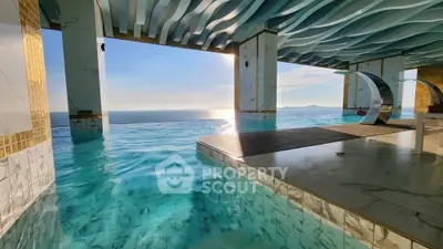 Luxurious rooftop infinity pool with stunning ocean view at sunset