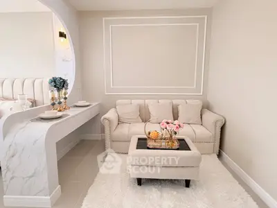 Elegant living room with plush sofa and chic decor in modern apartment