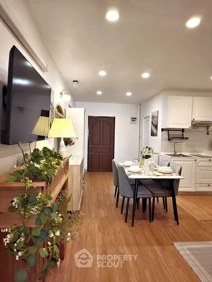 Charming open-plan living and dining area with modern decor and cozy ambiance.