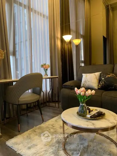 Elegant living room with modern decor, plush rug, and cozy seating area, perfect for relaxation.