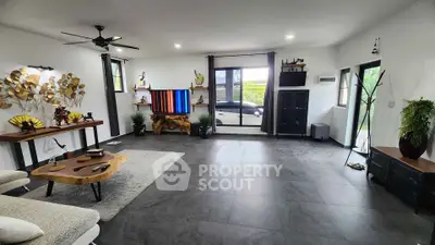 Spacious modern living room with stylish decor and large windows