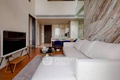 Luxurious modern living room with open kitchen and elegant decor