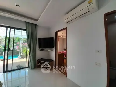 Modern living room with pool view and air conditioning