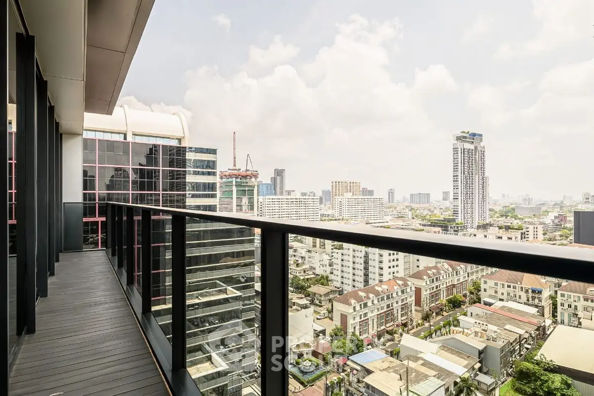 Stunning cityscape view from a modern high-rise balcony, perfect for urban living.