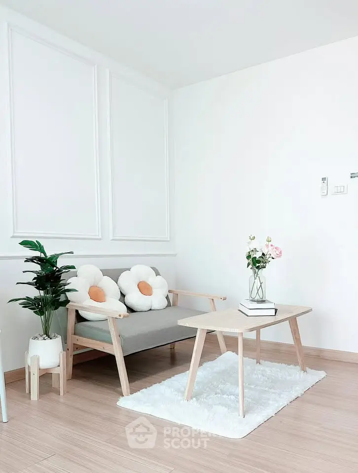 Charming minimalist living room with cozy seating and elegant decor