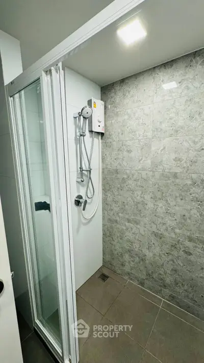 Modern bathroom with sleek shower and elegant tile design