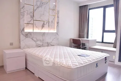 Modern bedroom with marble accent wall and large window view