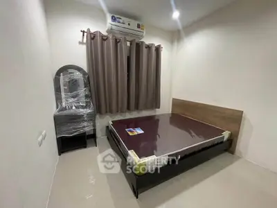 Modern bedroom with air conditioning and minimalist furniture