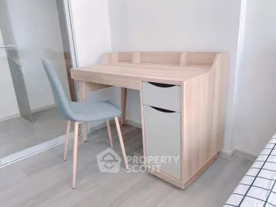 Modern study area with sleek desk and chair in bright room