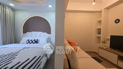 Modern studio apartment with stylish bedroom and cozy living area