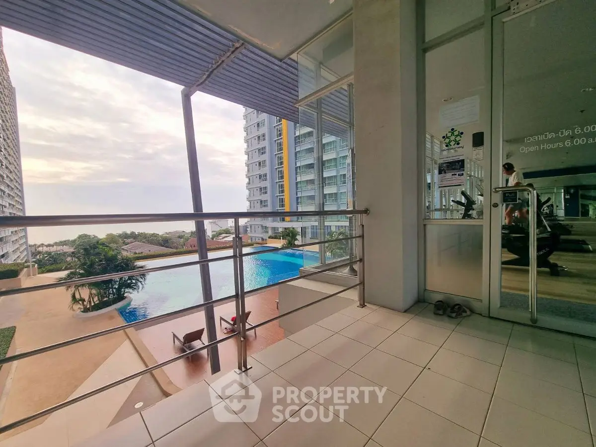 Stunning poolside view from modern balcony in high-rise building