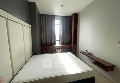 Modern minimalist bedroom with natural light and sleek furniture