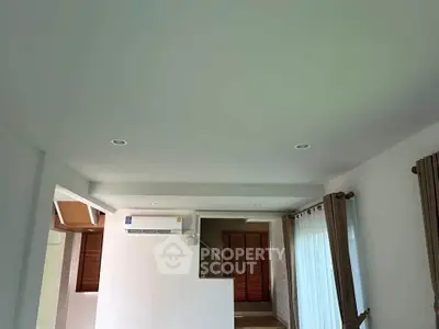 Spacious living room with modern air conditioning and natural light
