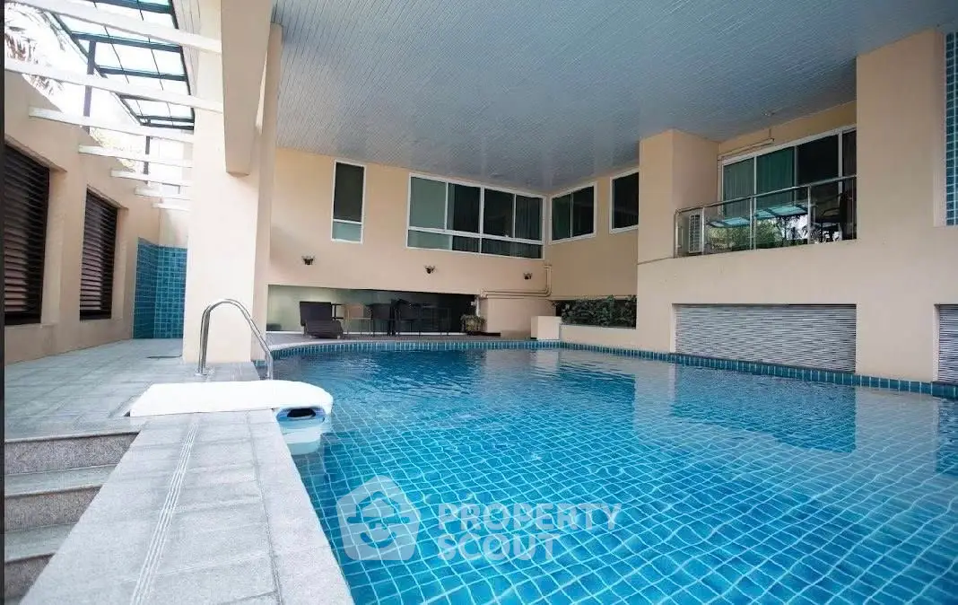 Luxurious indoor pool with modern design and natural lighting