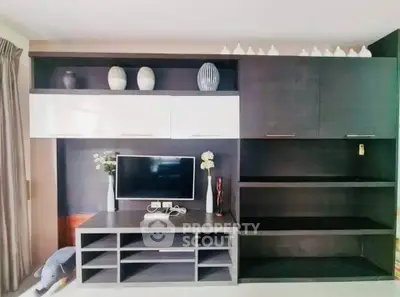 Modern living room with sleek entertainment center and stylish decor