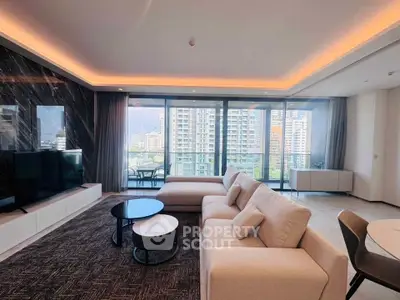 Luxurious living room with modern furniture and stunning city view from large windows.