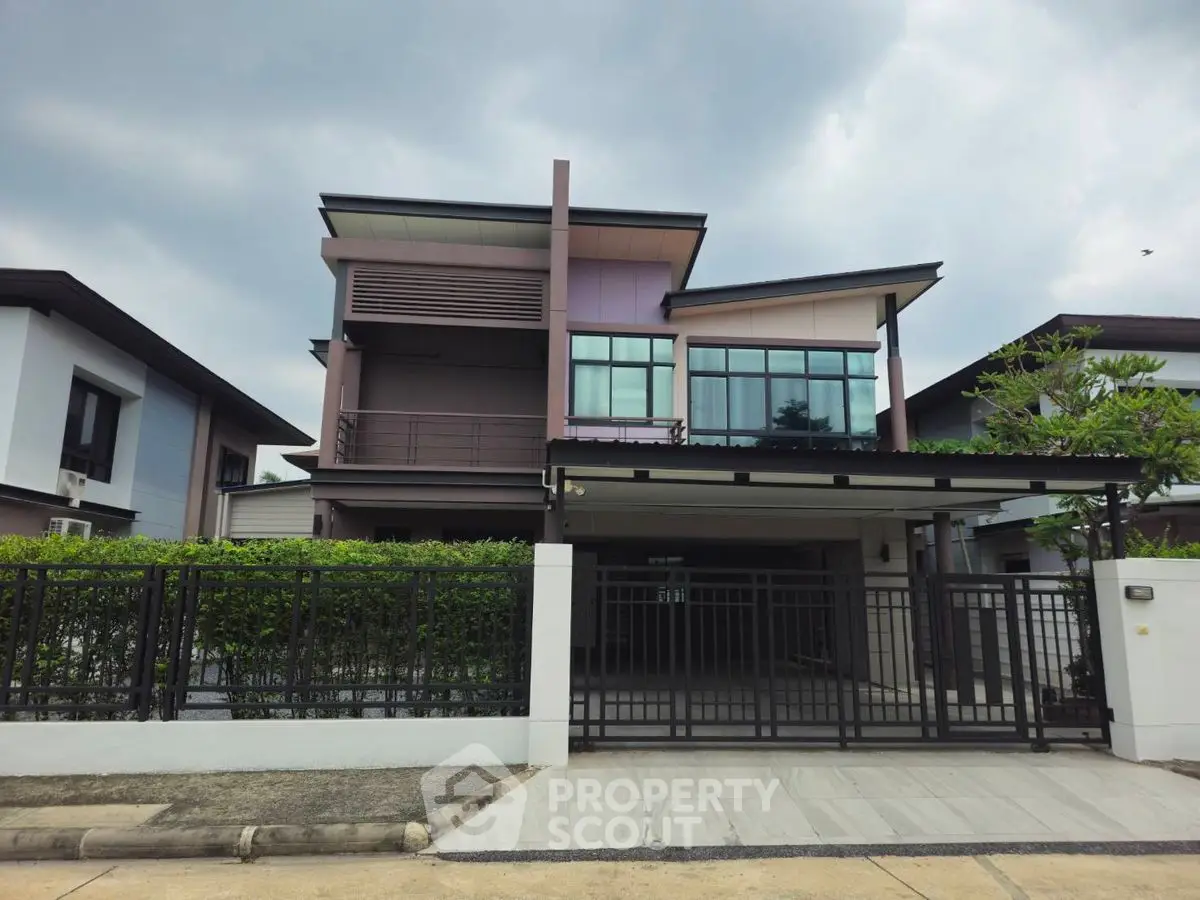 Modern two-story house with sleek design and spacious driveway