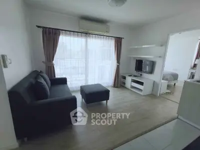 Modern living room with sleek furniture and natural light