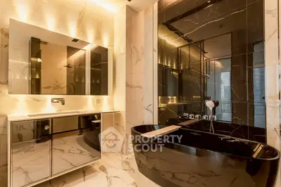 Luxurious modern bathroom with black marble bathtub and elegant lighting