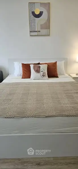 Cozy bedroom with modern decor and stylish bedding