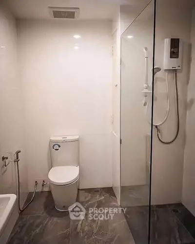 Modern bathroom with sleek design and glass shower enclosure