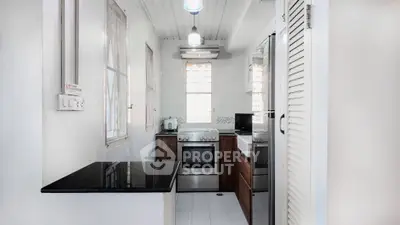 Charming kitchen with modern appliances and sleek design, perfect for culinary enthusiasts.