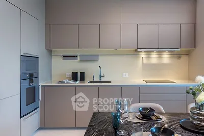 Modern kitchen with sleek cabinetry and elegant dining setup