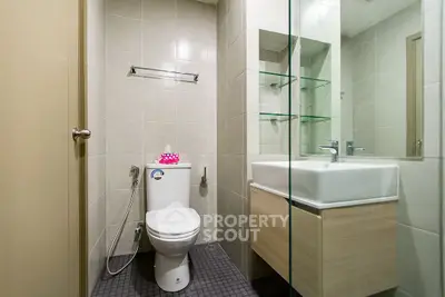 Modern bathroom with sleek fixtures and glass shower enclosure