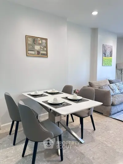 Modern dining area with sleek table and chairs in stylish apartment