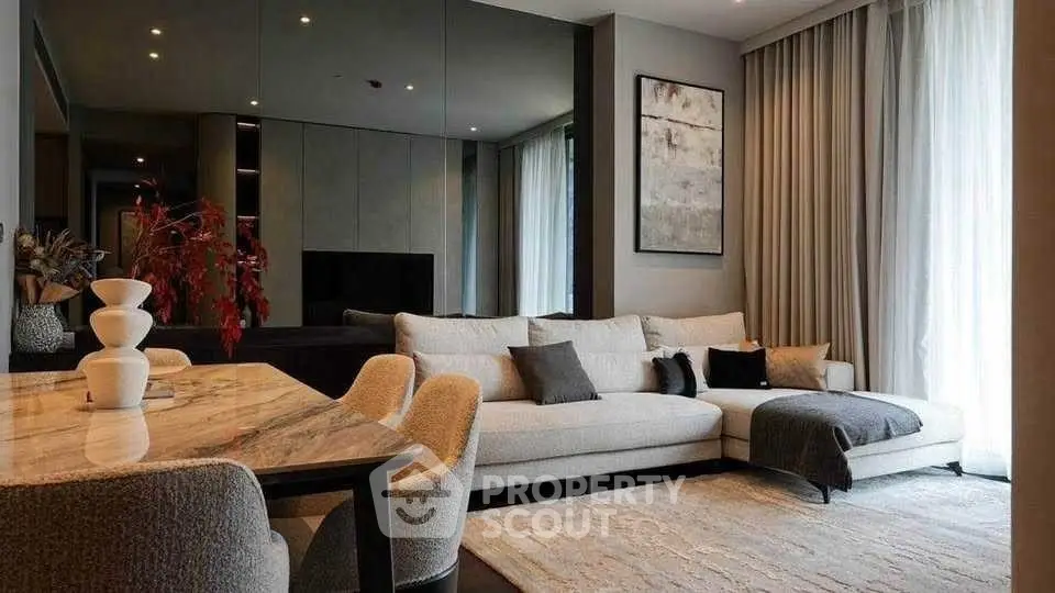 Luxurious modern living room with elegant decor and cozy seating area.