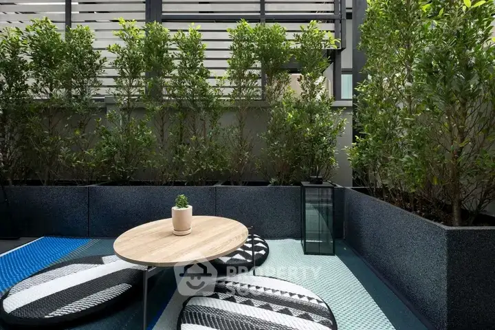 Chic outdoor garden space with modern seating and lush greenery