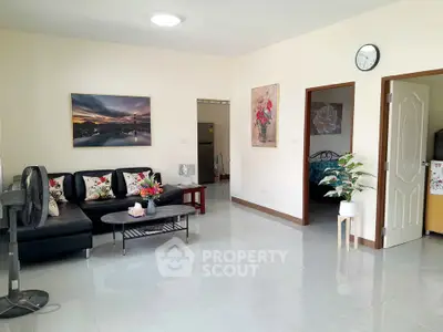 Spacious living room with modern decor and natural light