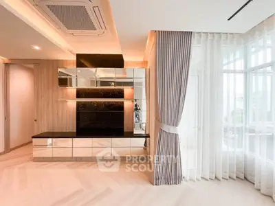 Elegant modern living room with stylish decor and large windows